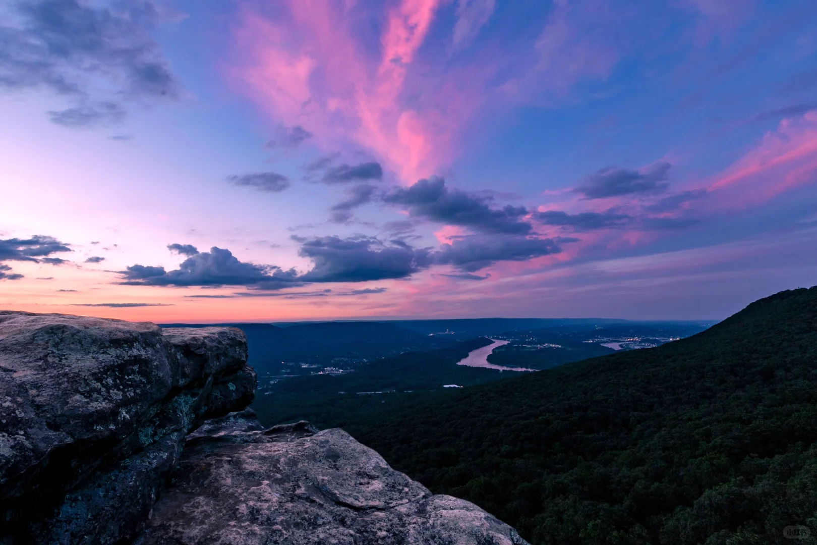 "Sunset at the Cliff's Edge: Gazing Over Mountains, Rivers, and Human Civilization"